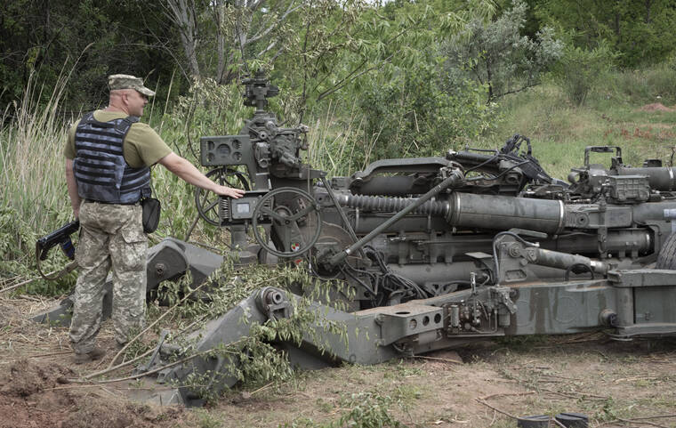 ASSOCIATED PRESS
                                A Ukrainian soldier stands at a U.S.-supplied M777 howitzer in Ukraine’s eastern Donetsk region Saturday, June 18, 2022.