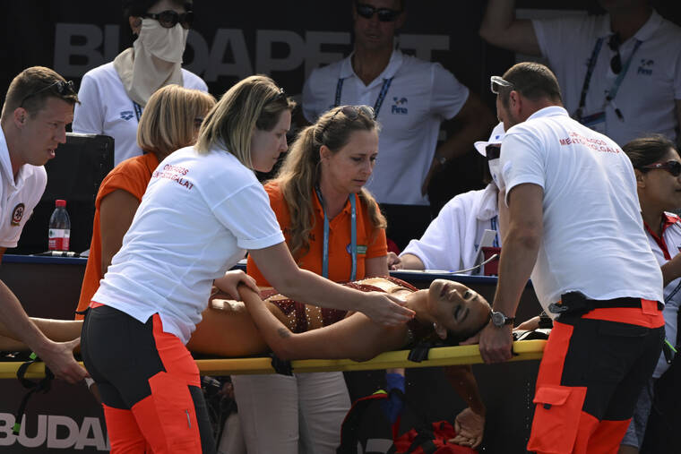 ZSOLT SZIGETVARY/MTI VIA AP
                                Anita Alvarez of United States is taken on a stretcher from the pool after collapsing during the solo free final of the artistic swimming at the 19th FINA World Championships in Budapest, Hungary.