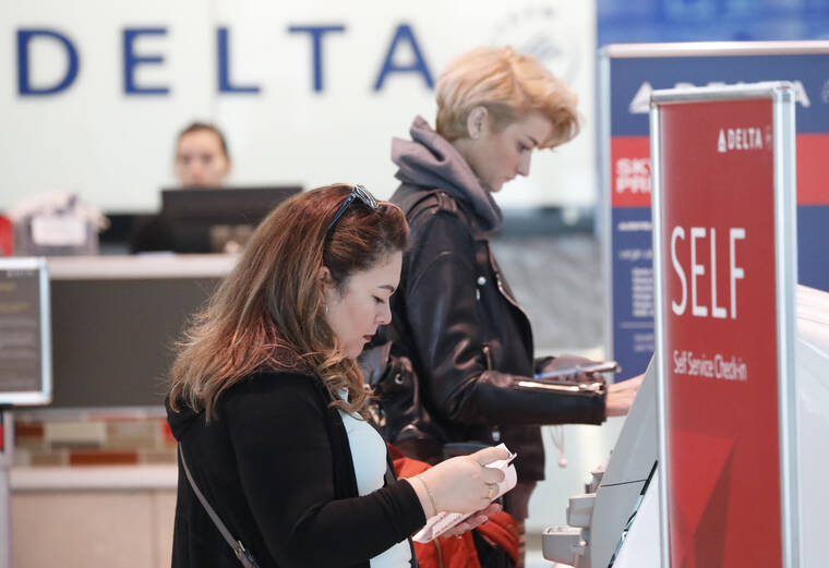 ASSOCIATED PRESS / 2019
                                Travelers use the Delta airlines self-check-in at Love Field in Dallas. Delta Air Lines will be able to continue operating flights at Dallas Love Field for another six years, under a settlement approved by the city council. The agreement, which passed without debate this week, appears to end a long court fight over gates at the city-owned airport near downtown Dallas that is dominated by Southwest Airlines.