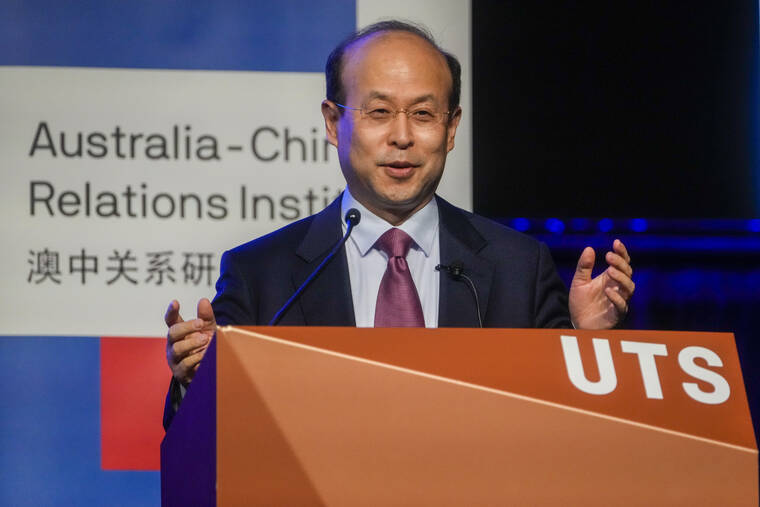 ASSOCIATED PRESS
                                China’s Ambassador to Australia Xiao Qian gestures during his address on the state of relations between Australia and China at the University of Technology in Sydney.
