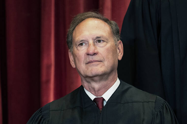 ASSOCIATED PRESS / APRIL 23
                                Associate Justice Samuel Alito sits during a group photo at the Supreme Court in Washington in April. Alito wrote the court decision, released today, to overturn Roe vs. Wade.
