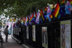ASSOCIATED PRESS / JUNE 22
                                A visitor views a historical exhibit of the Gay rights movement, displayed on fencing dressed with flags affirming LGBTQ identity at the Stonewall National Monument, Wednesday, in New York.