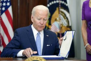 PABLO MARTINEZ MONSIVAIS / AP
                                President Joe Biden signs into law S. 2938, the Bipartisan Safer Communities Act gun safety bill, in the Roosevelt Room of the White House in Washington, Saturday.