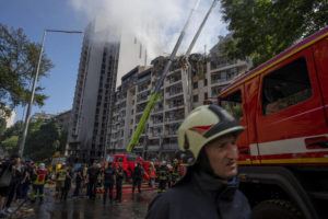 ASSOCIATED PRESS
                                Firefighters work at the scene of a residential building following explosions, in Kyiv, Ukraine, today.