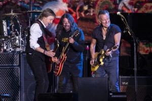 JOEL C RYAN / INVISION VIA AP
                                Paul McCartney, from left, Dave Grohl and Bruce Springsteen perform at Glastonbury Festival in Worthy Farm, Somerset, England, Saturday.