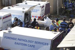 ASSOCIATED PRESS
                                A body is removed from a nightclub in East London, South Africa, today. South African police are investigating the deaths of at least 20 people at a nightclub in the coastal town early this morning.