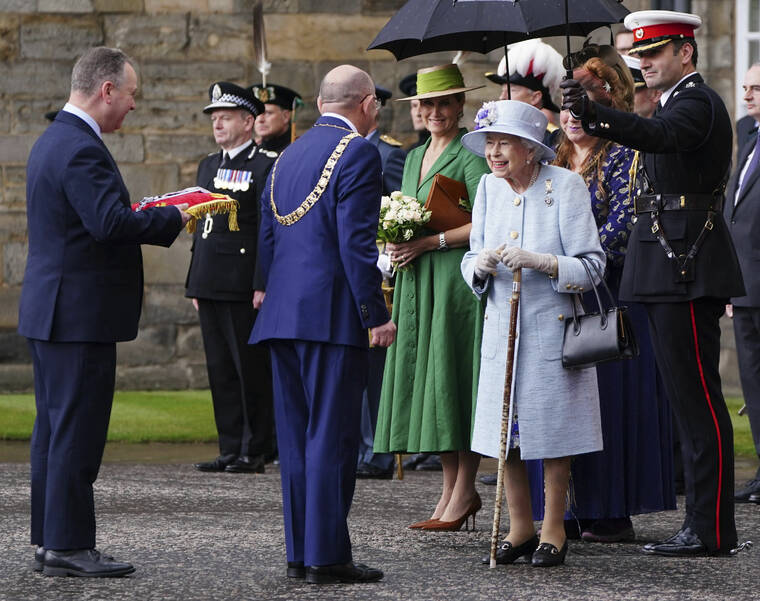 JANE BARLOW/PA VIA AP
                                Britain’s Queen Elizabeth II is greeted as she attends the Ceremony of the Keys on the forecourt of the Palace of Holyroodhouse in Edinburgh as part of her traditional trip to Scotland for Holyrood week.