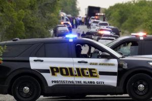 ASSOCIATED PRESS
                                Police block the scene where a tractor-trailer with multiple dead bodies was discovered in San Antonio.
