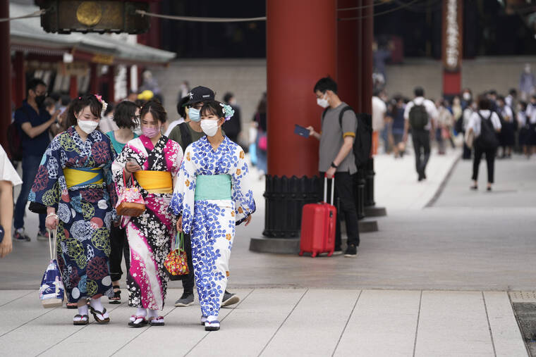 ASSOCIATED PRESS
                                People visit Sensoji Buddhism temple in Tokyo’s Asakusa area famous for sightseeing, Wednesday. Japan is bracing for a return of tourists from abroad, as border controls to curb the spread of coronavirus infections are gradually loosened.