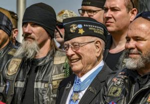 GREG EANS/THE MESSENGER-INQUIRER VIA ASSOCIATED PRESS
                                Hershel “Woody” Williams, center, the sole surviving U.S. Marine to be awarded the Medal of Honor during World War II, poses with fellow Marines at the Charles E. Shelton Freedom Memorial at Smothers Park, in April 2019, in Owensboro, Ky. Williams, the last remaining Medal of Honor recipient from World War II, died today. He was 98.