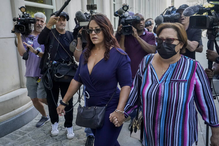 ASSOCIATED PRESS
                                Lizzette Martinez, author of “Jane Doe #9 how I survived R.Kelly,” left, arrives at federal court, today, in the Brooklyn borough of New York. The former R&B superstar was convicted of racketeering and other crimes.