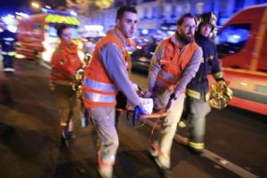 ASSOCIATED PRESS / 2015
                                A woman is evacuated from the Bataclan concert hall after a shooting in Paris.