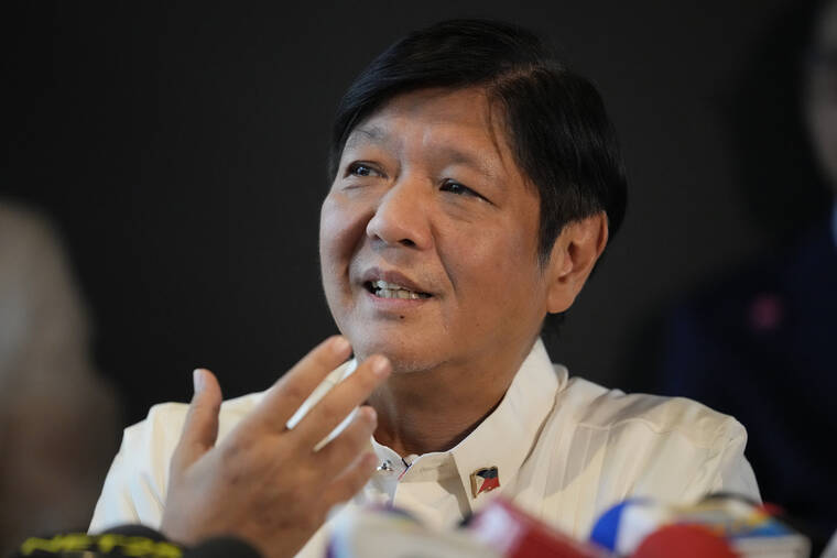 ASSOCIATED PRESS / JUNE 20
                                Philippine President-elect Ferdinand “Bongbong” Marcos Jr. gestures during a press conference at his headquarters in Mandaluyong, Philippines.