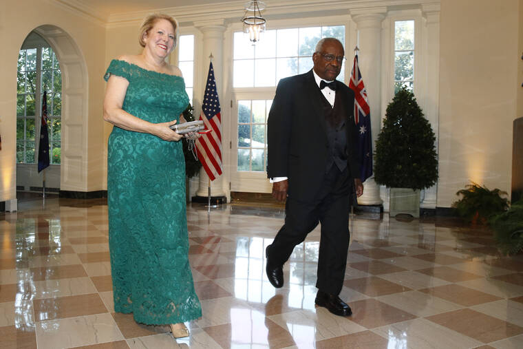 ASSOCIATED PRESS
                                Supreme Court Associate Justice Clarence Thomas, right, and wife Virginia Thomas arrive for a State Dinner with Australian Prime Minister Scott Morrison and President Donald Trump at the White House in Washington on Sept. 20, 2019.