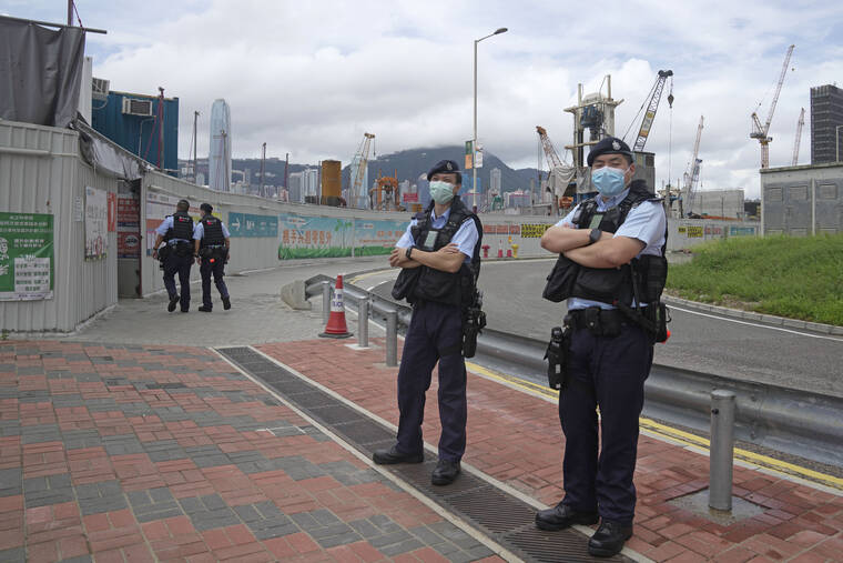 ASSOCIATED PRESS
                                Police officers patrol outside the high speed train station for the Chinese president Xi Jinping’s visit to mark the 25th anniversary of Hong Kong’s handover to China in Hong Kong.