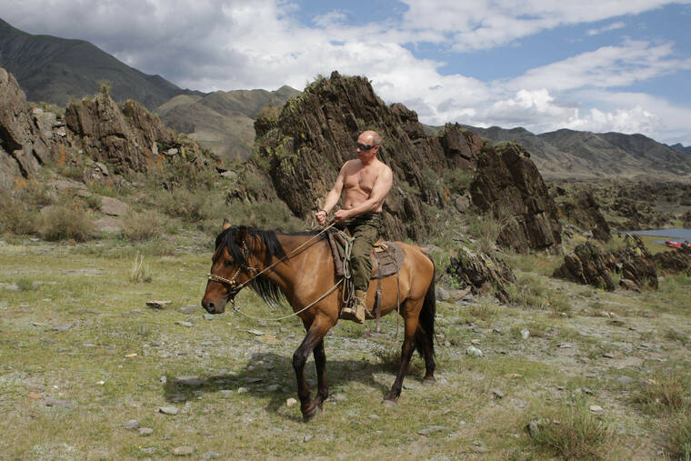 ALEXEI DRUZHININ/POOL PHOTO VIA ASSOCIATED PRESS
                                Then Russian Prime Minister Vladimir Putin rides a horse while traveling in the mountains of the Siberian Tyva region (also referred to as Tuva), Russia, in August 2009. Putin has shot back at Western leaders who mocked his athletic exploits, saying they would look “disgusting” if they tried to emulate his bare-torso appearances.