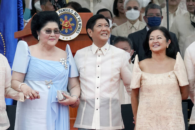 ASSOCIATED PRESS
                                President Ferdinand Marcos Jr. stands with his mother Imelda Marcos, left, and his wife Maria Louise Marcos, right, during the inauguration ceremony at National Museum on Thursday, in Manila, Philippines. Marcos was sworn in as the country’s 17th president.