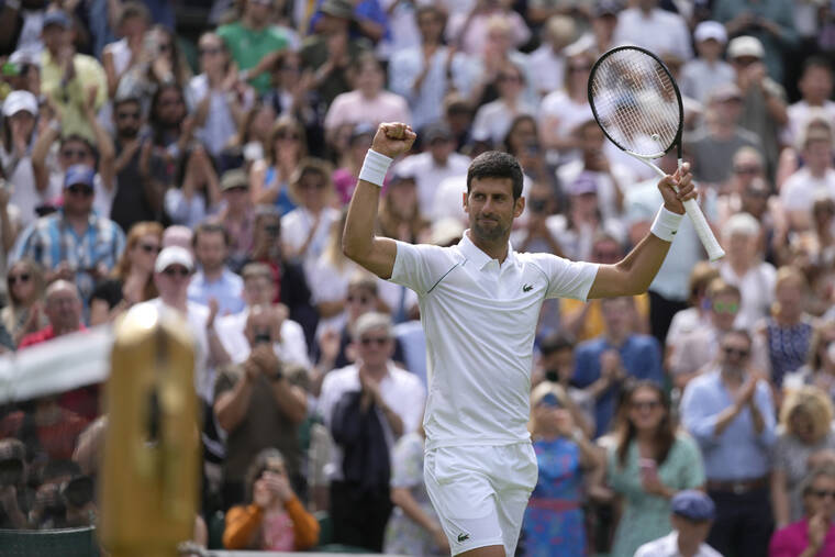 ASSOCIATED PRESS
                                Serbia’s Novak Djokovic celebrates defeating Australia’s Thanasi Kokkinakis in a singles tennis match on day three of the Wimbledon tennis championships in London, Wednesday. Reigning Wimbledon champion Novak Djokovic famously decided not to get vaccinated against COVID-19 — which prevented him from playing at the Australian Open in January following a legal saga that ended with his deportation from that country, and, as things currently stand, will prevent him from entering the United States to compete at the U.S. Open in August.