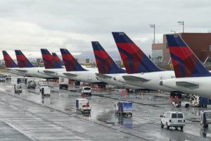 ASSOCIATED PRESS
                                Delta planes sit at their gates, June 13, at Salt Lake City International Airport, in Salt Lake City. Delta Air Lines has agreed to pay $10.5 million to settle charges it falsified information about deliveries of international mail, including mail sent to U.S. soldiers overseas.