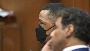 POOL PHOTO / AP
                                Eric Holder, left looks on with his attorney during closing arguments at his trial for the 2019 first-degree murder of the 33-year-old hip-hop star Nipsey Hussle on Thursday in Los Angeles.
