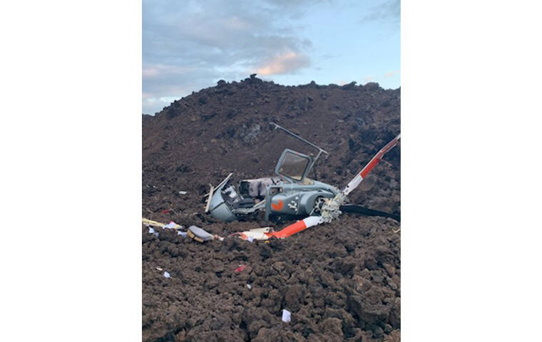 HAWAII COUNTY FIRE DEPARTMENT VIA AP
                                A photo provided by the Hawaii County Fire Department shows the scene where a helicopter crashed in a Big Island lava field on Wednesday.