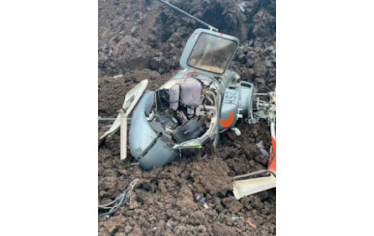HAWAII COUNTY FIRE DEPARTMENT VIA AP
                                A photo provided by the Hawaii County Fire Department shows the scene where a helicopter crashed in a Big Island lava field on Wednesday.