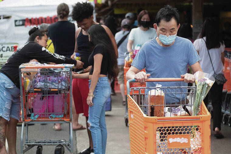 GEORGE F. LEE / GLEE@STARADVERTISER.COM
                                The cost of groceries has been rising in Honolulu. Above, shoppers pushed carts Wednesday outside of Don Quijote on Kaheka Street.