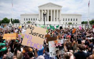 ASSOCIATED PRESS
                                Protesters gather outside the Supreme Court in Washington, today. The Supreme Court has ended constitutional protections for abortion that had been in place for nearly 50 years, a decision by its conservative majority to overturn the court’s landmark abortion cases.