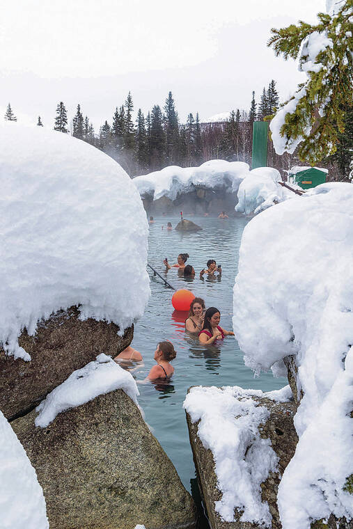 DOUGLAS PEEBLES / SPECIAL TO THE STAR-ADVERTISER
                                Guests take a dip in the geothermal pool at the Chena Hot Springs Resort.