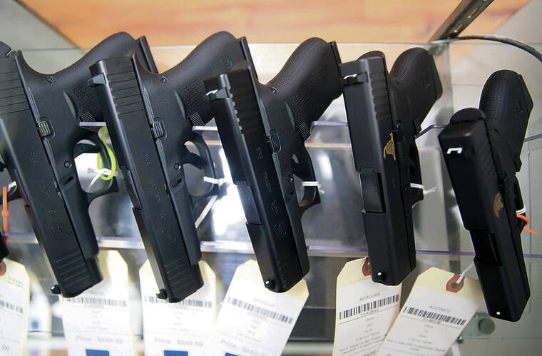JAMM AQUINO / JAQUINO@STARADVERTISER.COM
                                Glock handguns were for sale at 808 Gun Club on Thursday.