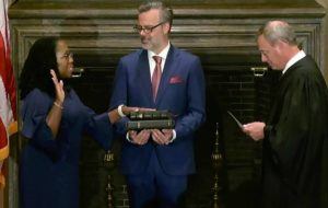 SUPREME COURT VIA ASSOCIATED PRESS
                                Chief Justice of the United States John Roberts administers the Constitutional Oath to Ketanji Brown Jackson as her husband Patrick Jackson holds the Bible at the Supreme Court in Washington, today.