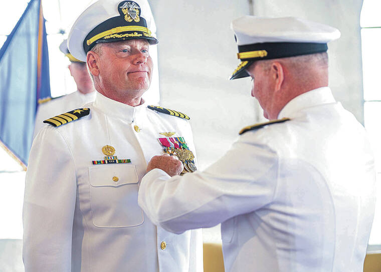 U.S. NAVY
                                Rear Adm. Timothy Kott, commander, Navy Region Hawaii, presented Capt. Erik Spitzer, commander, Joint Base Pearl Harbor-Hickam, the Legion of Merit medal Monday during a change-of-command ceremony aboard the USS Missouri Memorial. Spitzer was relieved by Capt. Mark Sohaney during the ceremony.