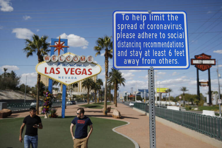 ASSOCIATED PRESS
                                A sign advises people to practice social distancing, in March 2020, to slow the spread of the coronavirus at the “Welcome to Fabulous Las Vegas Nevada” sign amid a shutdown of casinos along the Las Vegas Strip in Las Vegas. The biggest growth for Native Hawaiian or other Pacific Islanders took place in metro Las Vegas’ Clark County and California’s Sacramento County.