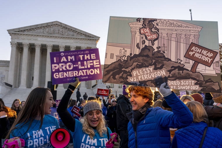 ASSOCIATED PRESS
                                Anti-abortion protesters wear shirts that read “I am the Pro-Life Generation” as they demonstrate in front of the U.S. Supreme Court on Dec. 1 in Washington.