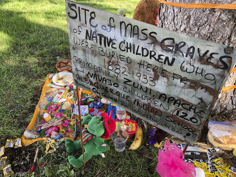 ASSOCIATED PRESS
                                A makeshift memorial for the dozens of Indigenous children who died more than a century ago while attending a boarding school that was once located nearby is displayed under a tree at a public park in Albuquerque, N.M., on July 1, 2021.