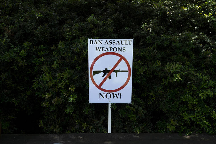 ASSOCIATED PRESS
                                A sign demanding action on gun control is seen during a protest against the National Rifle Association’s annual meeting in Houston on May 27.