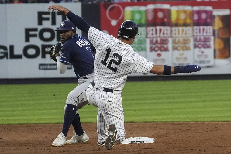 ASSOCIATED PRESS
                                Tampa Bay Rays second baseman Vidal Brujan, left, prepares to throw to first as New York Yankees shortstop Isiah Kiner-Falefa, right, slides into second base on Wednesday.