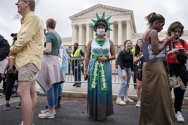 ASSOCIATED PRESS / MAY 14
                                Sonia Glenn, 27, of Fairfax, Va., poses for a portrait as she wears a lady liberty costume for abortion rights outside the Supreme Court in Washington, during protests across the country.