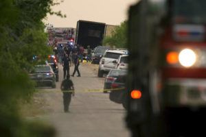 ASSOCIATED PRESS
                                Body bags lie at the scene where a tractor-trailer with multiple dead bodies was discovered in San Antonio.