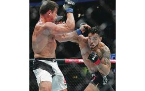 ASSOCIATED PRESS / 2016
                                Brad Tavares, right, punched Caio Magalhaes during a middleweight bout at UFC 203 in 2016, in Cleveland. Tavares has fought for the company 20 times.