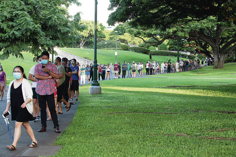 CINDY ELLEN RUSSELL / 2020
                                In-person voting sites were overwhelmed during the 2020 general election. Above, people wait in line to vote at Honolulu Hale on Election Day.	The line was backed into the parking garage across from the Frank Fasi Municipal Building.