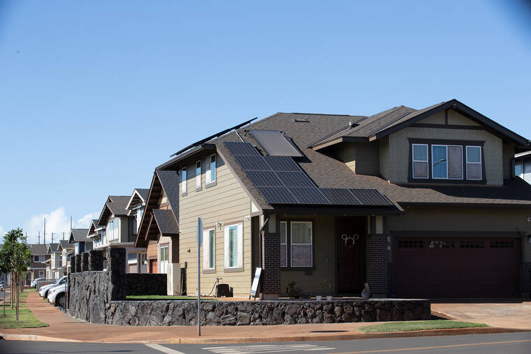 GEORGE F. LEE / GLEE@STARADVERTISER.COM
                                Homes with solar panels are seen at Koa Ridge.