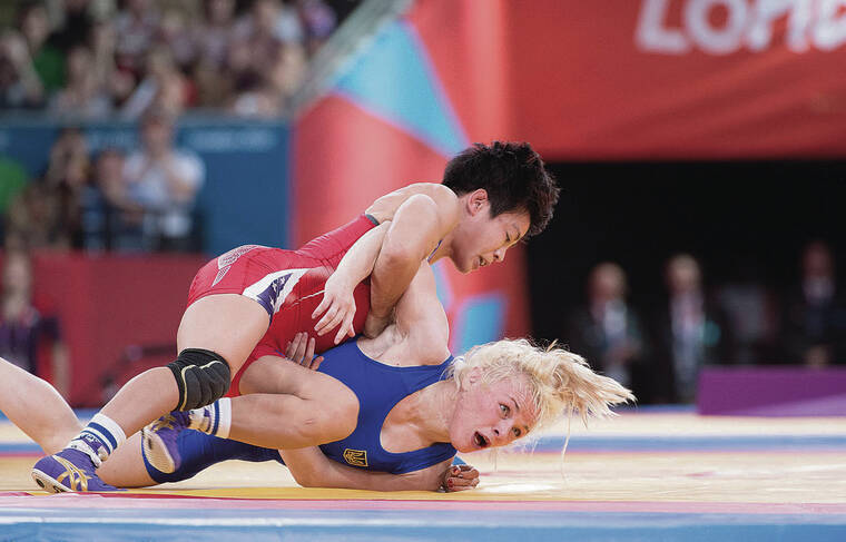 COURTESY LARRY SLATER
                                Clarissa Chun used an arm throw to gain control against Ukraine’s Irina Merleni to clinch the victory and earn her bronze medal at the 2012 London Games. Merleni was the 2004 Olympic gold medalist who defeated Chun for bronze in the 2008 Games.