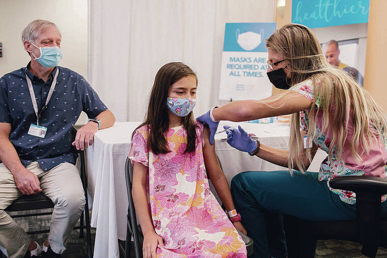 COURTESY HAWAII PACIFIC HEALTH
                                Children age 5 to 11 already have been eligible for COVID-19 vaccines. Above, a girl gets a COVID-19 vaccine at Kapiolani Medical Center for Women & Children. Now children ages 6 months to 5 years are eligible for the vaccines.
