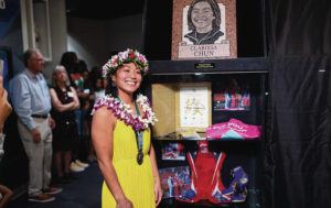 COURTESY LARRY SLATER
                                Clarissa Chun stood by her display stand during the National Wrestling Hall of Fame induction ceremony early this month.