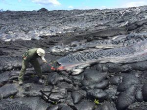 COURTESY OF HVO
                                A Hawaiian Volcano Observatory geologist collects a fresh lava sample for chemical analysis Thursday.