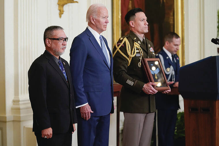 ASSOCIATED PRESS / JULY 5
                                President Joe Biden presents the Medal of Honor to Staff Sgt. Edward Kaneshiro for his actions during the Vietnam War, as his son John Kaneshiro, left, accepts the posthumous recognition in the East Room of the White House. A burial service was held July 22 at Punchbowl National Cemetery of the Pacific.