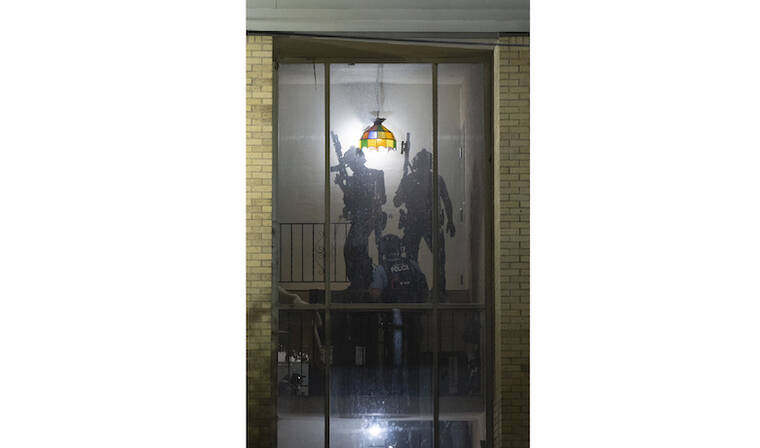JEFF WHEELER/STAR TRIBUNE VIA AP / JULY 13 
                                Minneapolis police officers gather outside the door to a third-floor apartment where a young man was in a standoff with police late Wednesday night and into Thursday morning. Officials say police in Minneapolis fatally shot a man, ending an hourslong standoff at an apartment building that began with shooting before officers arrived.
