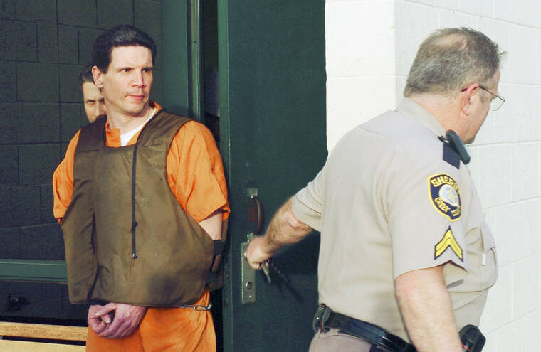OKLAHOMA DEPARTMENT OF CORRECTIONS VIA AP / FEB. 25, 2005
                                FILE - Scott Eizember, left, is taken out of the Canadian County Jail by members of the Creek County Sheriff’s Office after a jury approved the death penalty Eizember in El Reno, Okla. The Oklahoma Court of Criminal Appeals set execution dates for six death row inmates, just hours before an attorney for one planned to ask for a rehearing in his case. Execution dates for James Coddington, Richard Glossip, Benjamin Cole, Richard Fairchild, John Hanson and Scott Eizember were scheduled, starting Aug. 25 with Coddington and followed on Sept. 22 with Glossip.