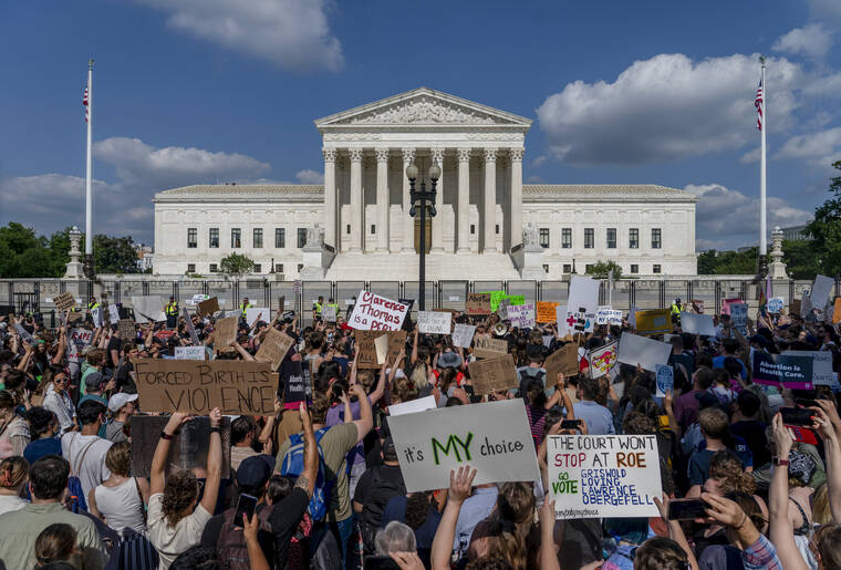ASSOCIATED PRESS
                                Abortion-rights and anti-abortion demonstrators gather outside of the Supreme Court in Washington on June 24.